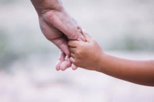 Grandmother Holding Childs Hand