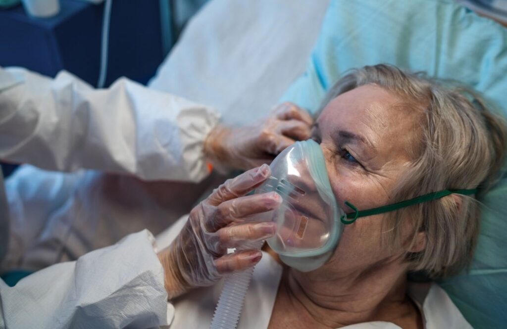 lady in a hospital bed with irregular breathing