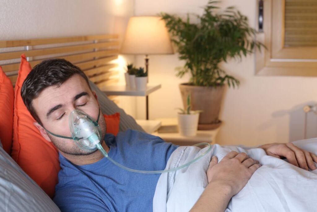 man in bed with breathing issues