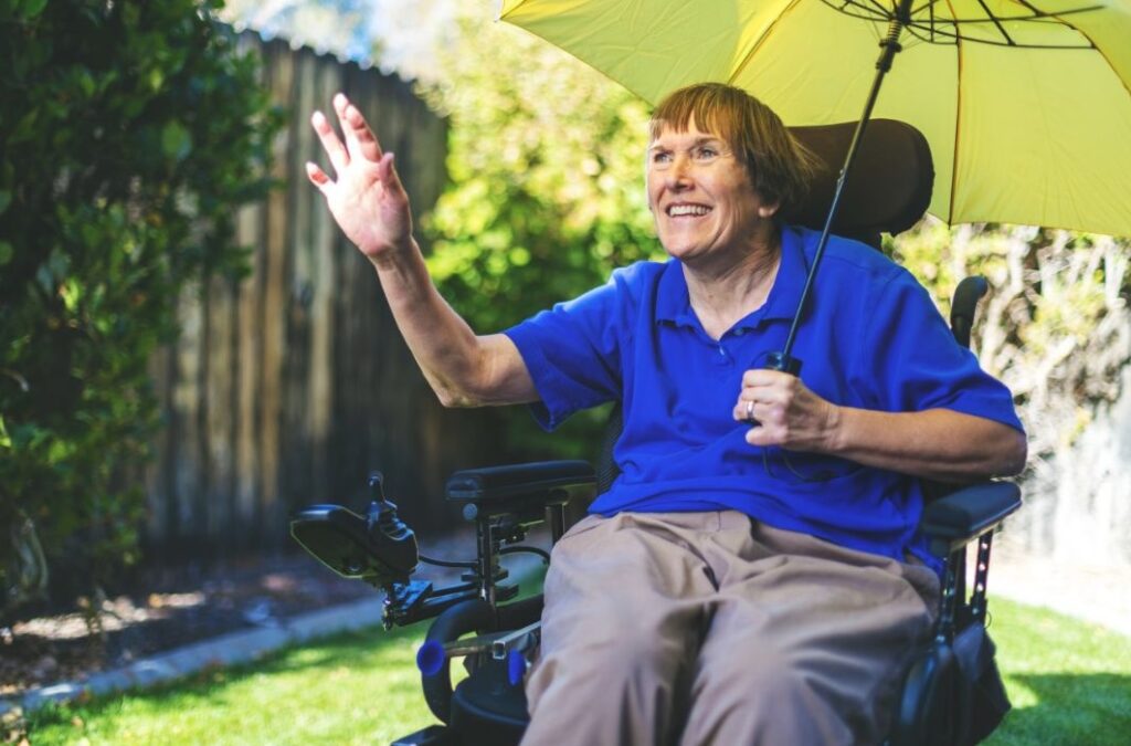 older woman in electric wheelchair with multiple sclerosis