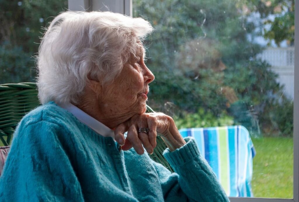 woman staying at home isolating due to dementia