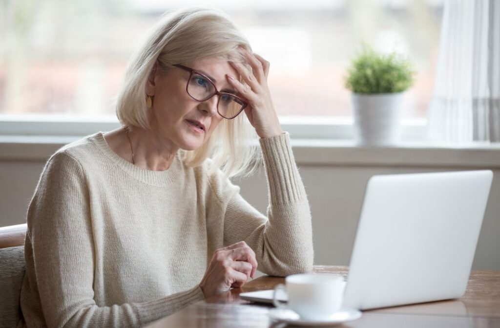 woman with slow thoughts sitting at a laptop